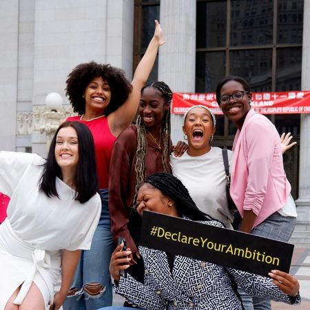 IGNITE fellows holding a "declare your ambition" sign